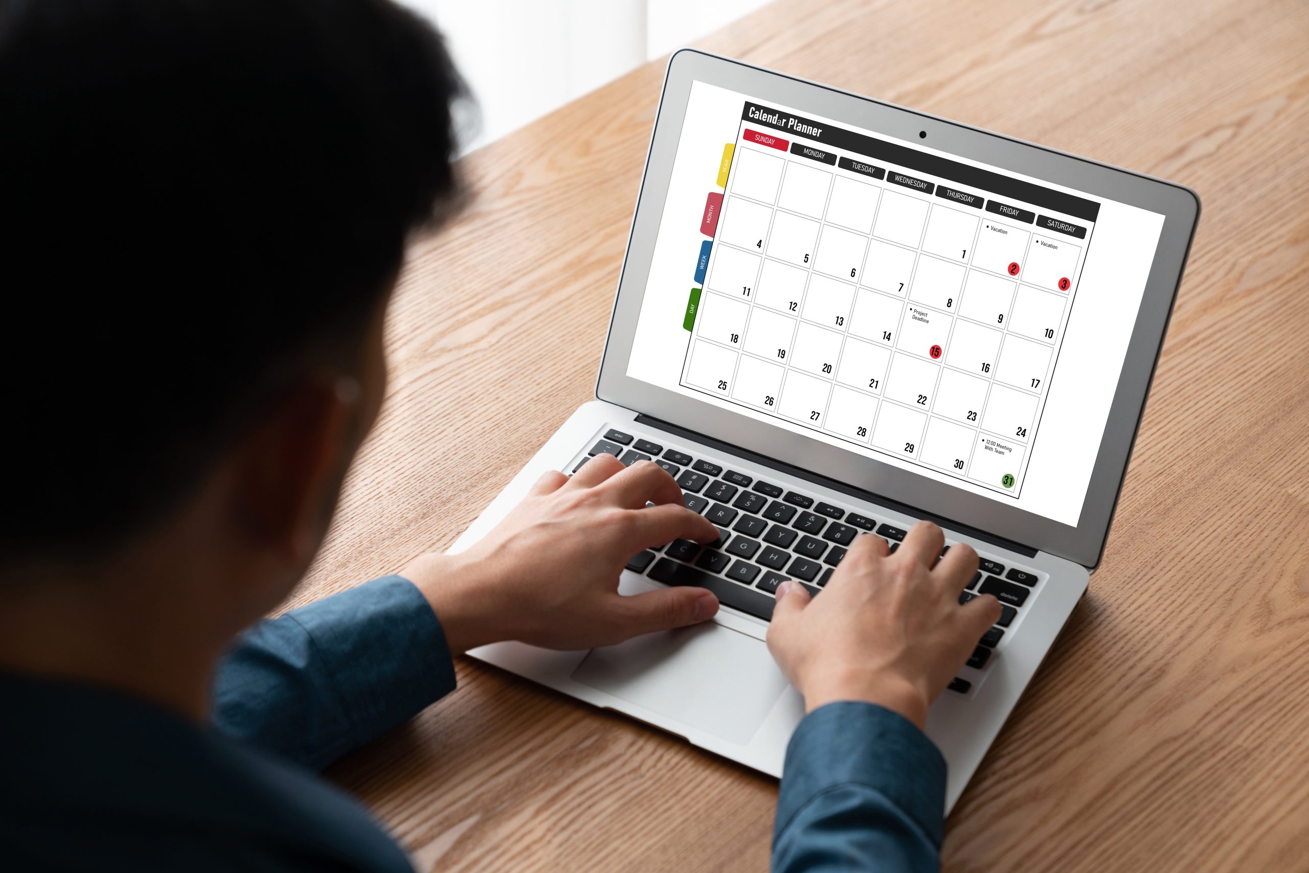 Person on laptop calendar